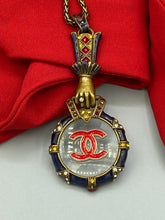 Load image into Gallery viewer, Vintage Magnifying Glass, Grasping Hand Necklace Pendant with Designer Button