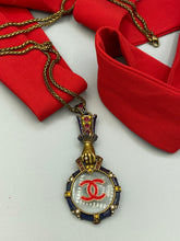Load image into Gallery viewer, Vintage Magnifying Glass, Grasping Hand Necklace Pendant with Designer Button